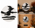 Handmade wooden Flying Witch Moon Plaque showing black witch silhouette on broomstick against a white circular moon disc, displayed on a mantelpiece and front door