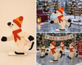 Handmade wooden skating bear decoration in small size, with bobble hat and scarf on ice skates, shown freestanding as a Christmas display piece