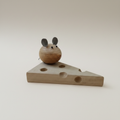 Handcrafted wooden mouse on cheese sculpture showing wood grain and artisan detail