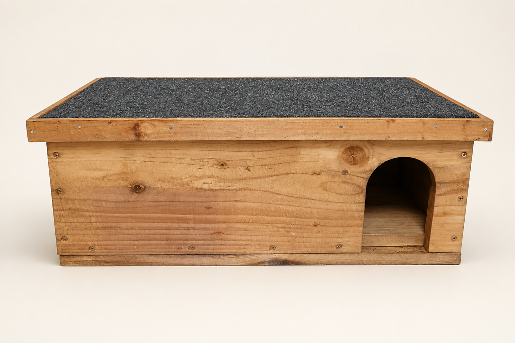 Front of wooden hedgehog house with arched entrance and felt roof