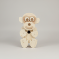 Handcrafted wooden monkey character bird box showing wood grain and carved detail